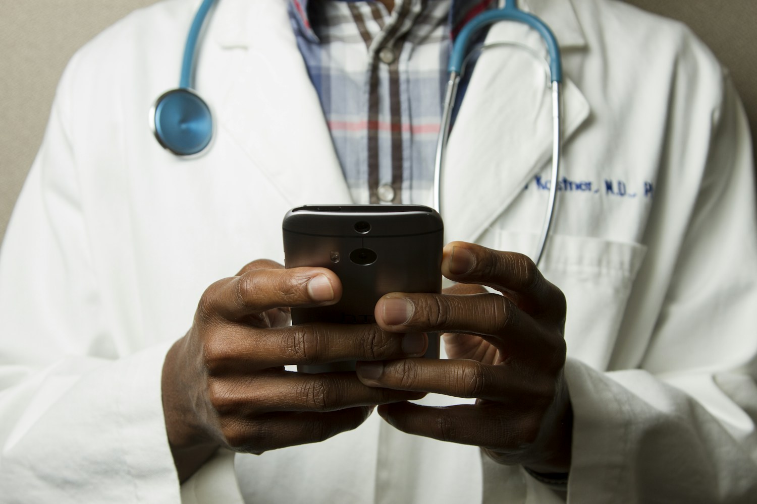 Healthcare professional using a digital tablet in a clinical setting
