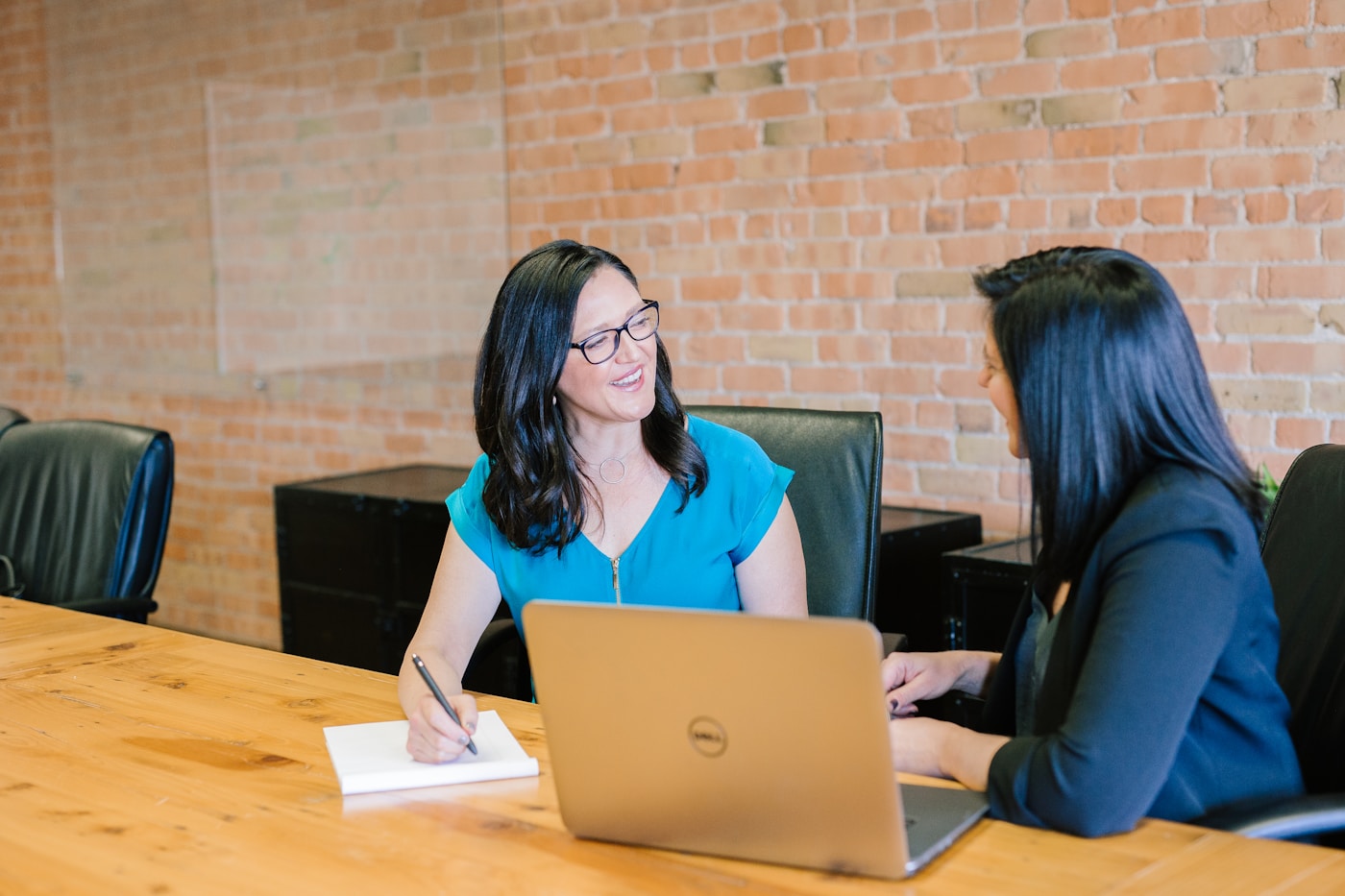 Professional team discussing client needs in a bright office